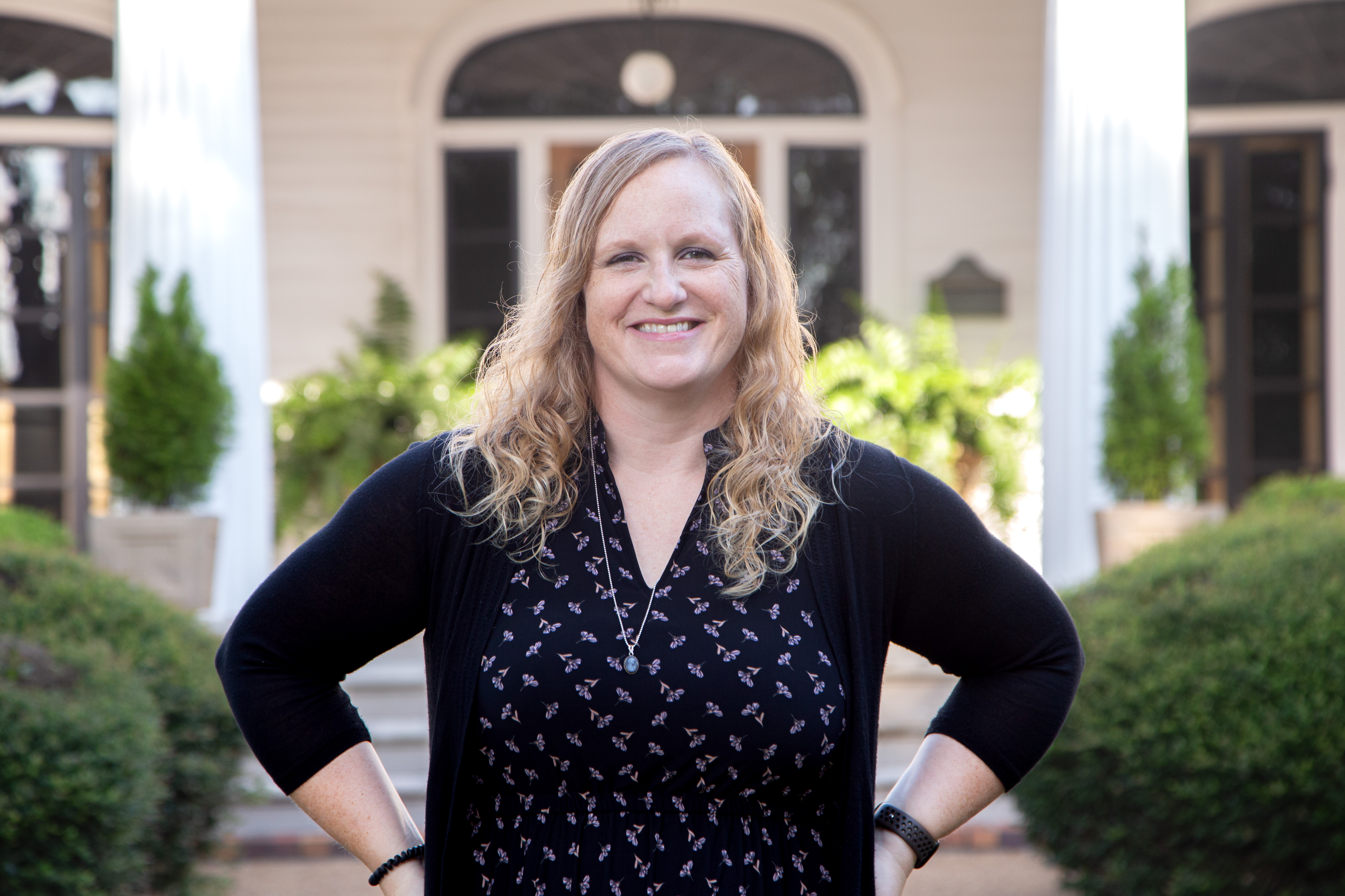 A photo of Dr. Holly J. Carey smiling at the camera.